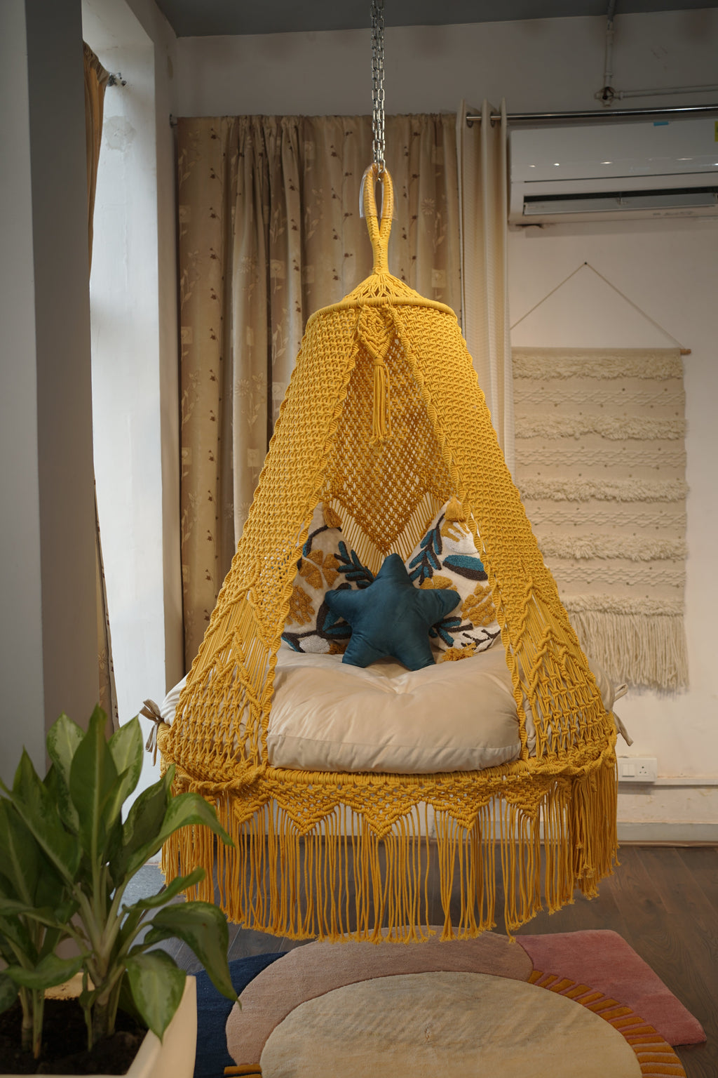 Sunny hanging macrame swing for two adults