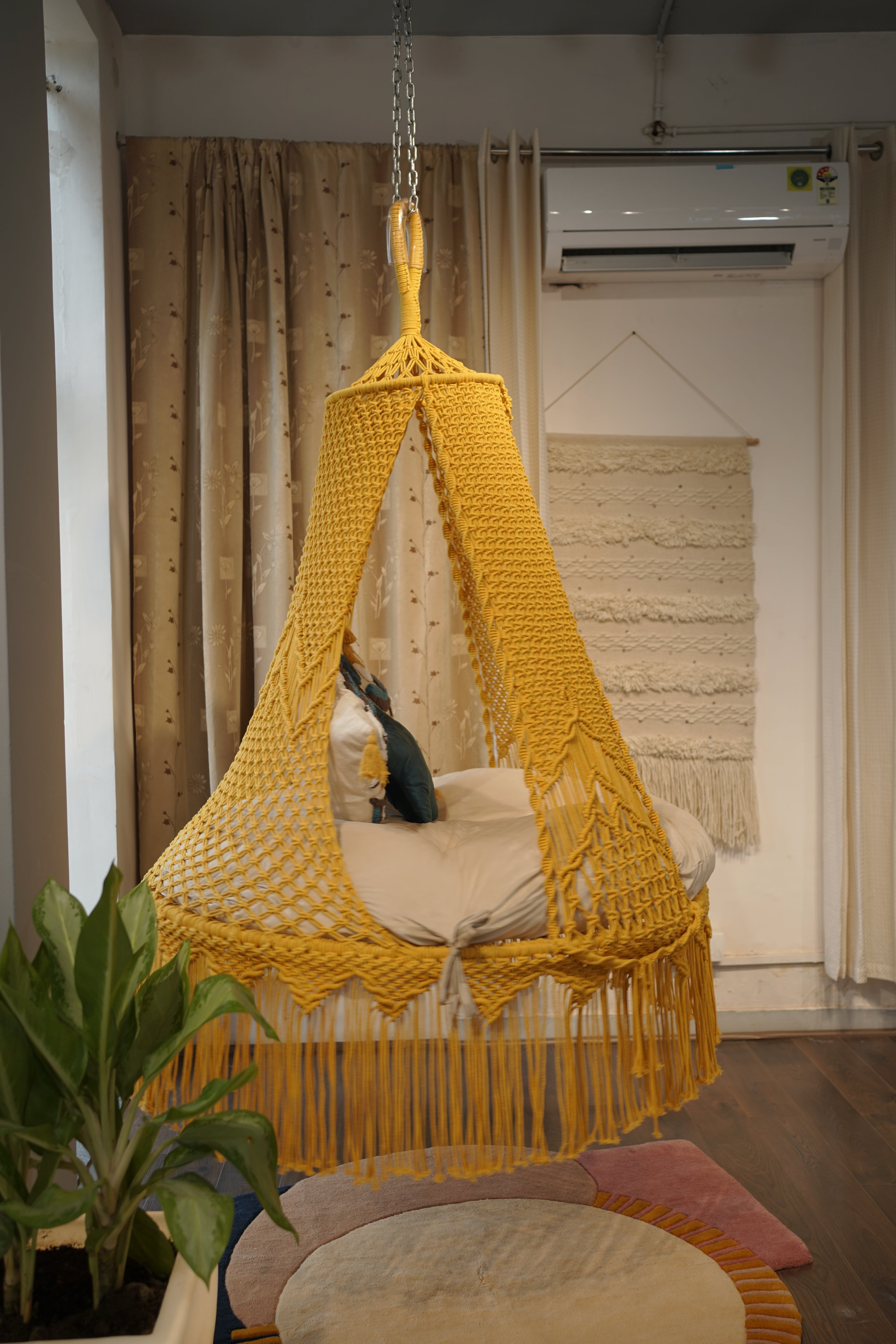 Sunny hanging macrame swing for two adults