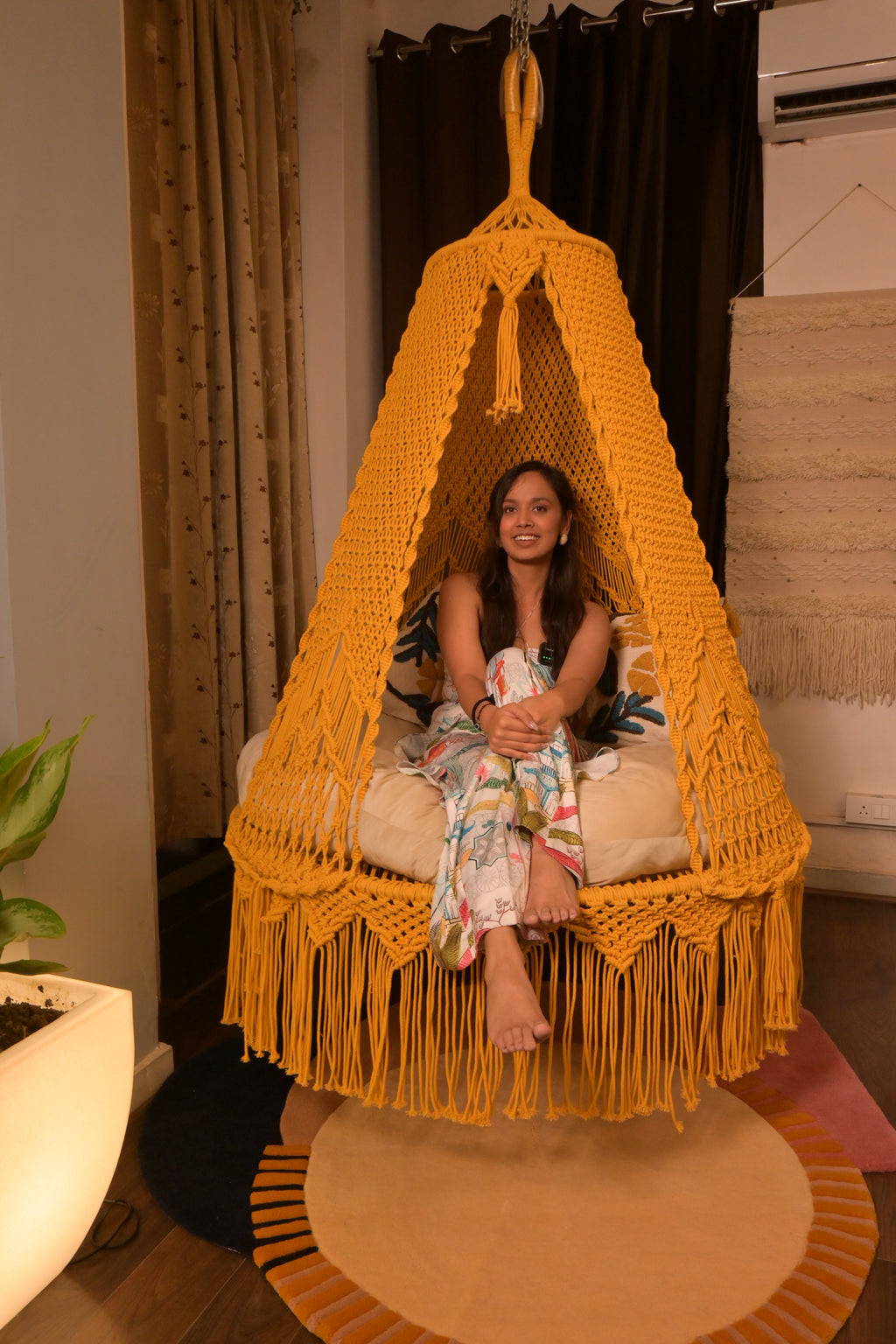 Sunny hanging macrame swing for two adults